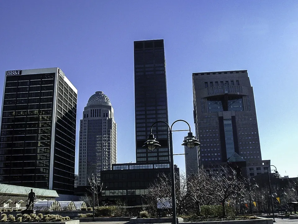 Downtown Louisville office towers under a clear blue sky