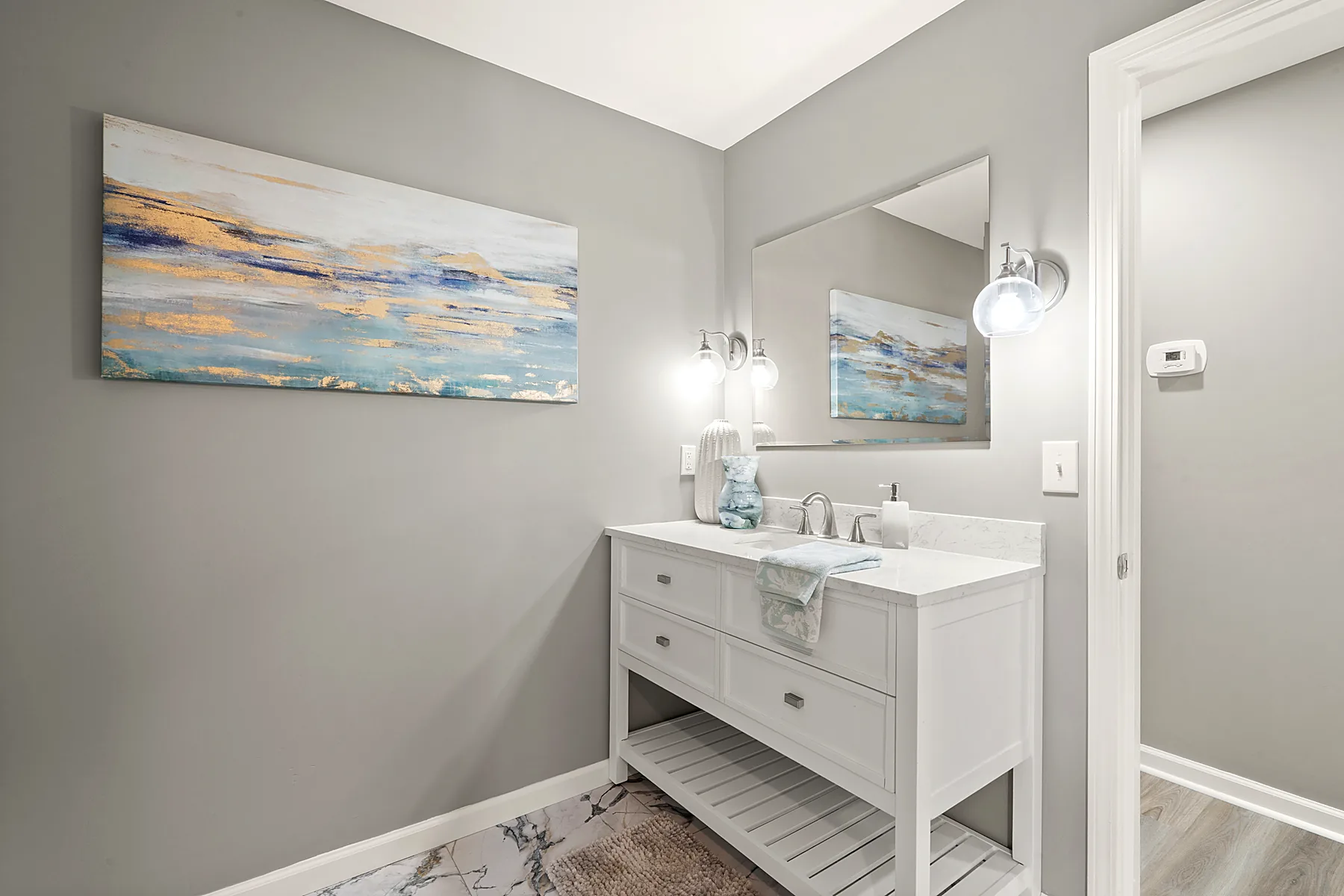 Renovated full bathroom with stylish tile surround and modern finishes