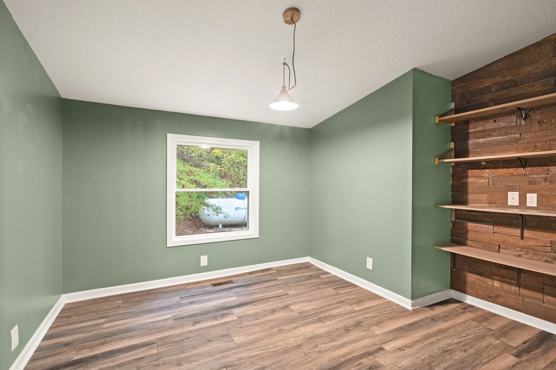 Green room with built-in shelves at 2206 Old State Road