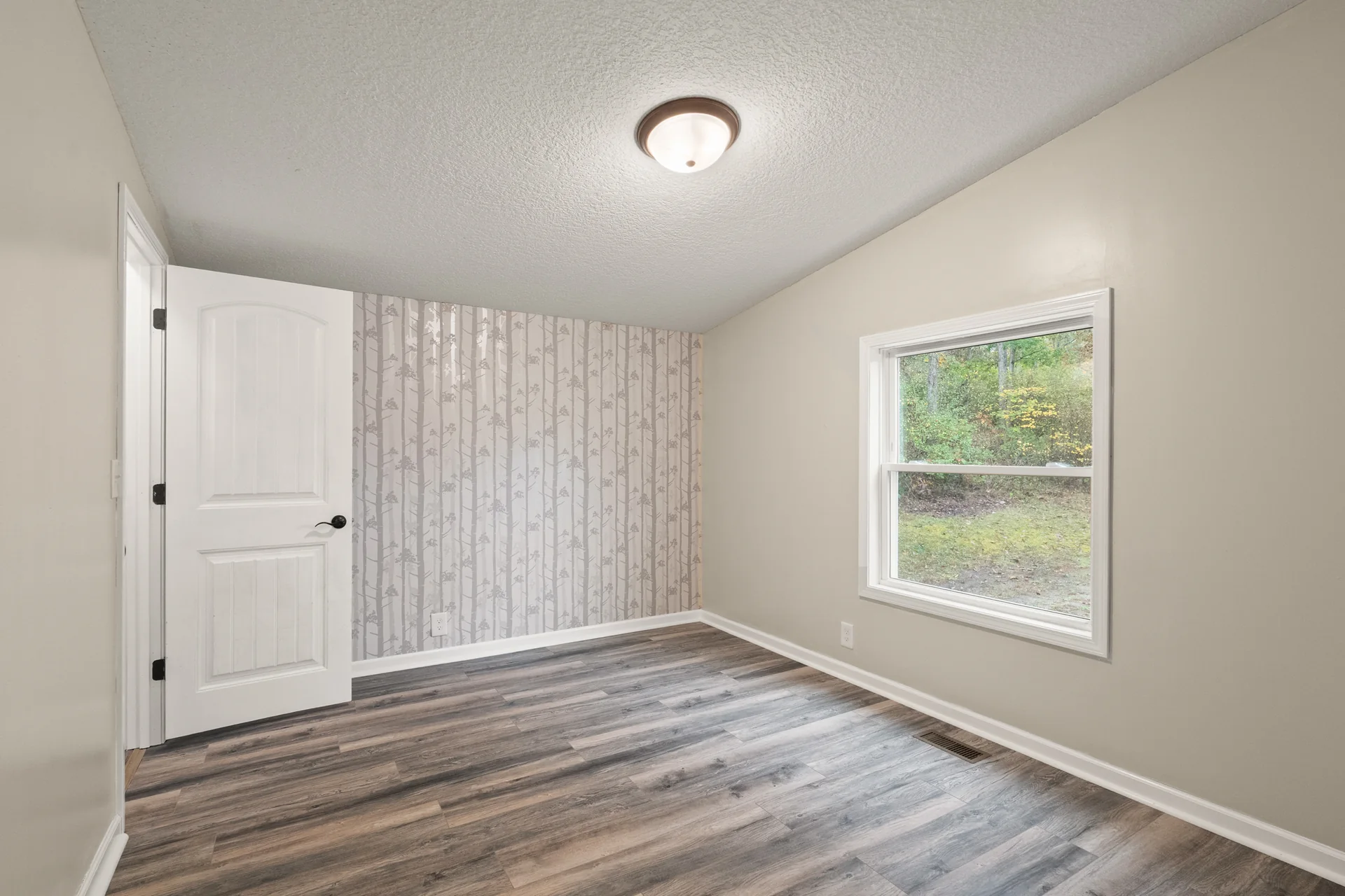 Bedroom with accent wall at 2206 Old State Road