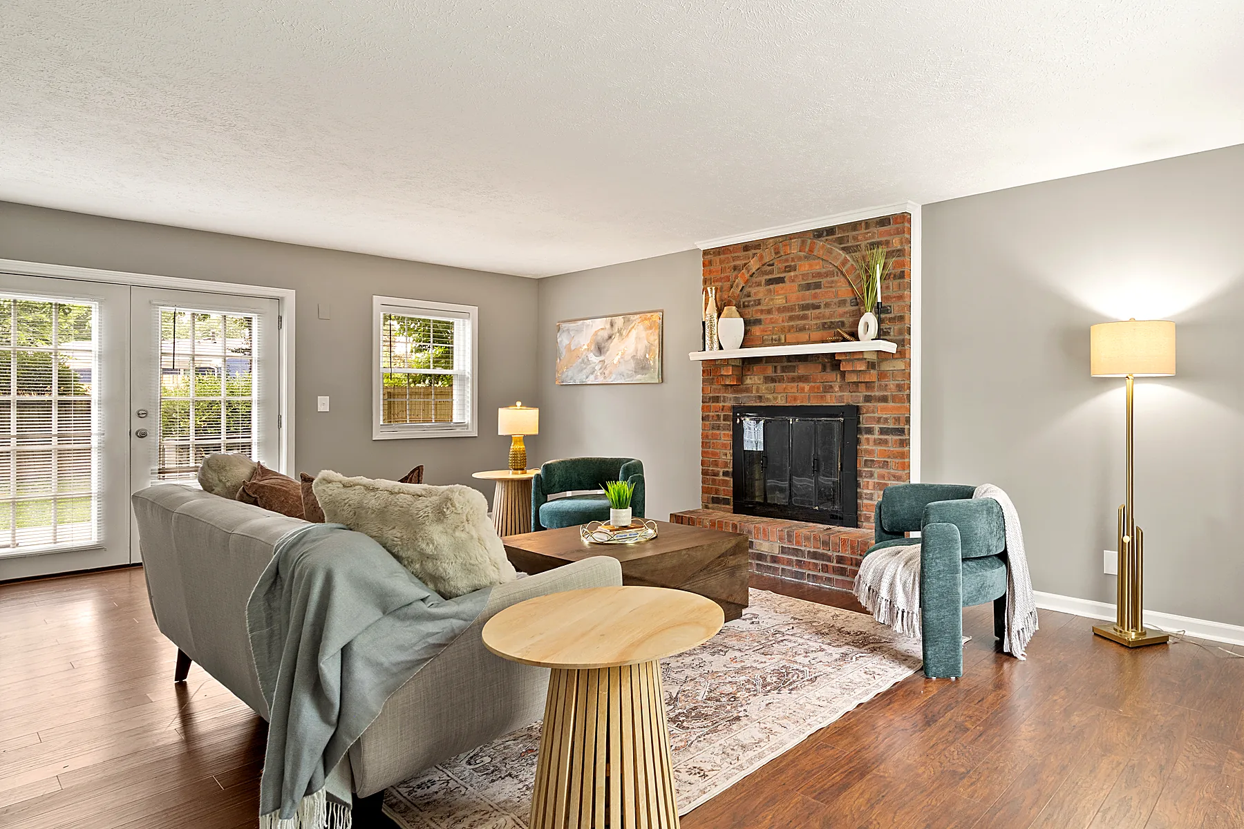 Large living room with a wood-burning fireplace at 2601 Stony Brook Drive