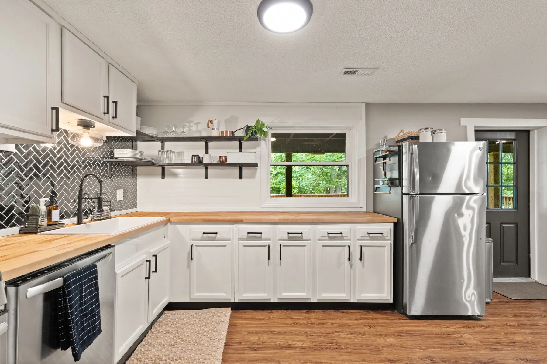 Kitchen — farmhouse sink and open shelving