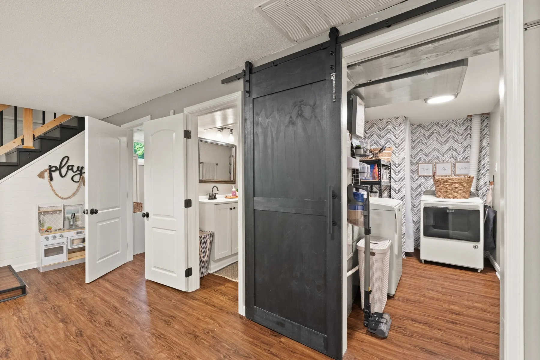 Laundry behind a black barn door