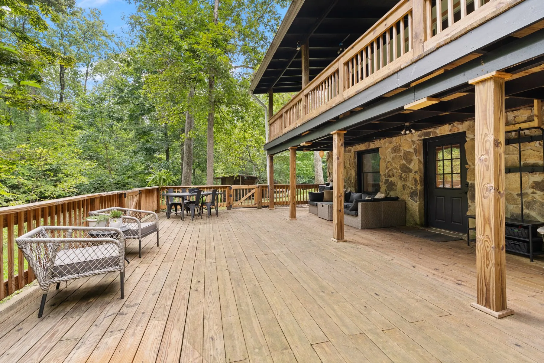 The 32-foot covered patio — stone wall and timber posts