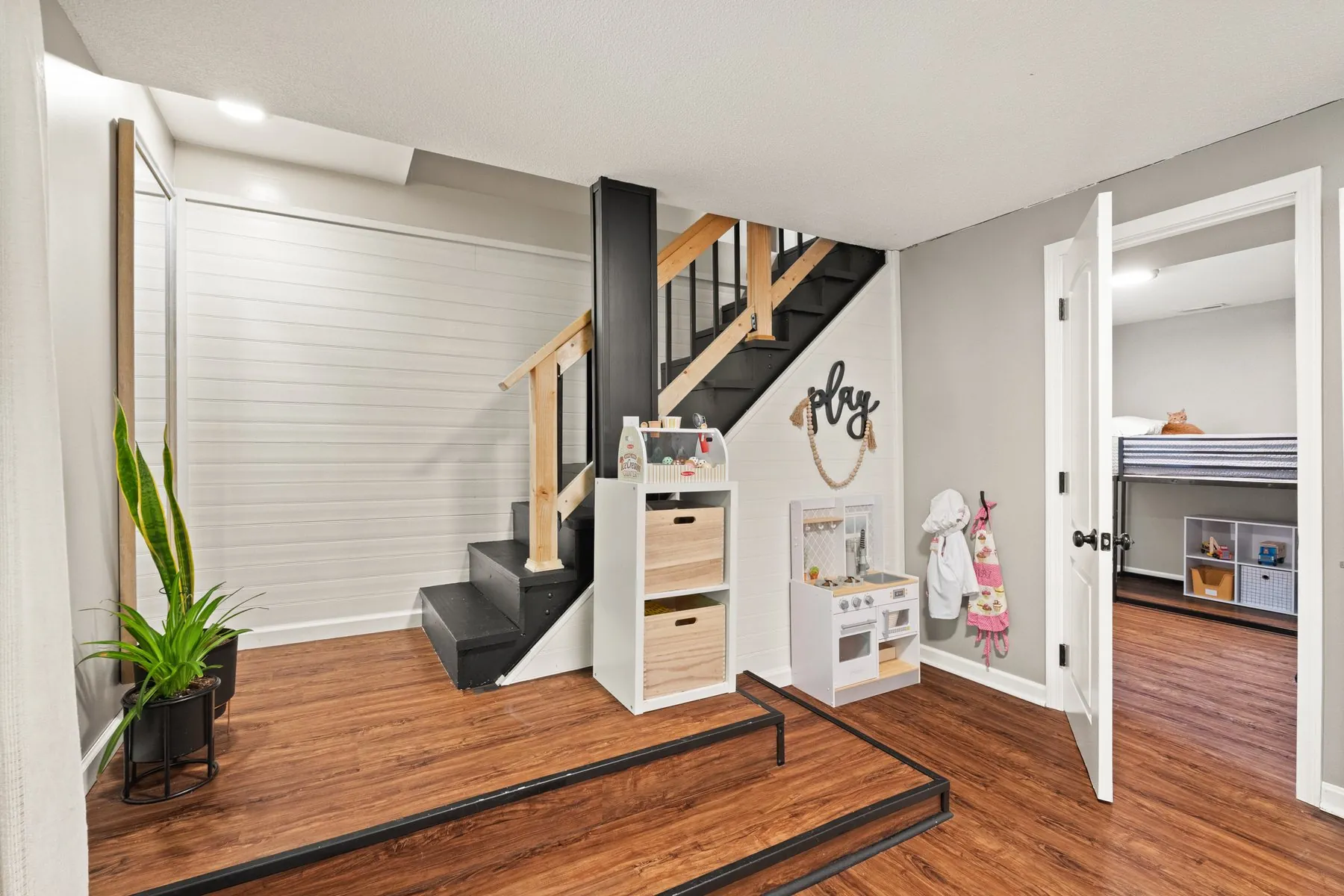 Stair down, with the playroom nook tucked underneath