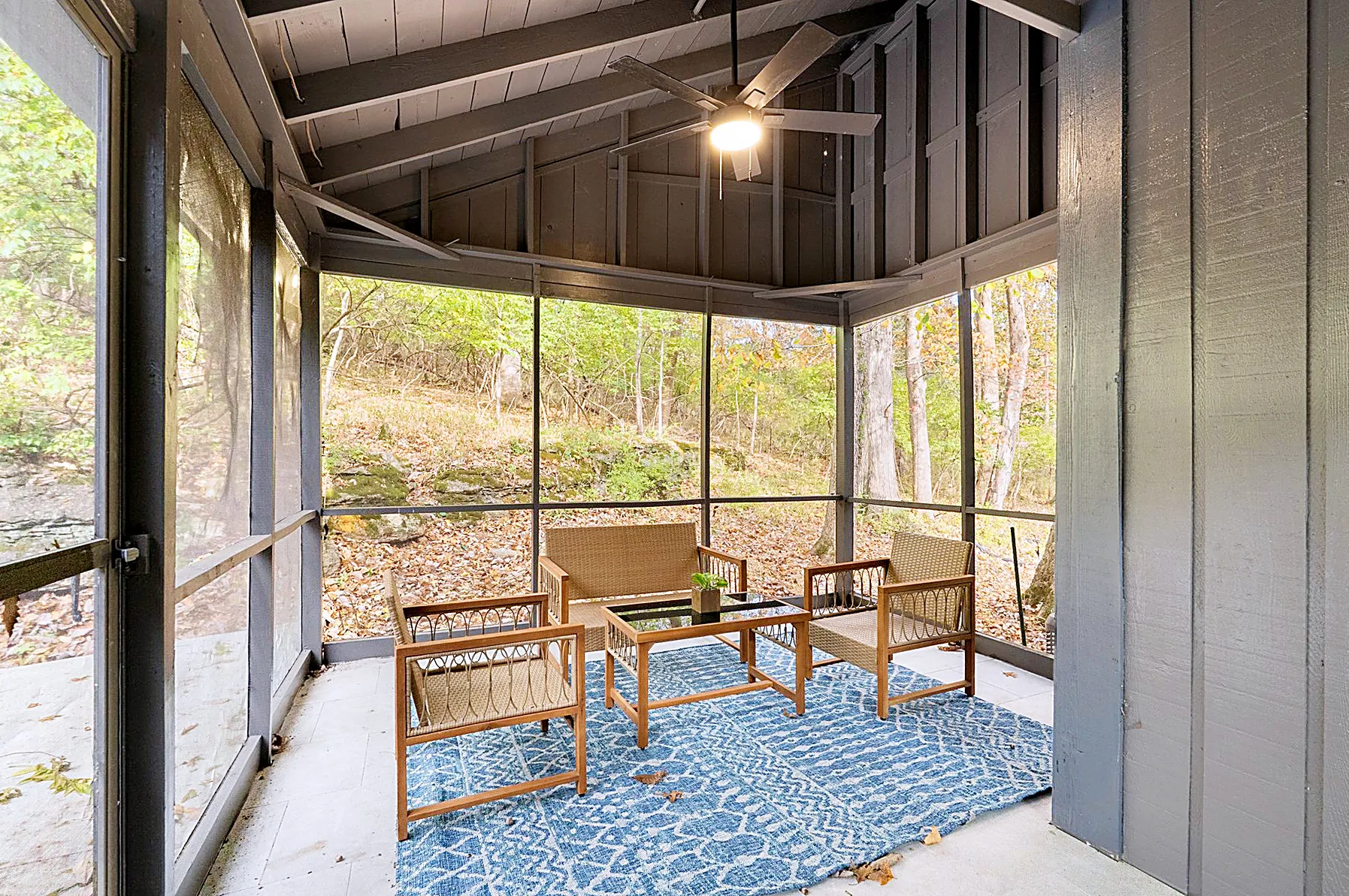 Screened-in porch overlooking the mature trees