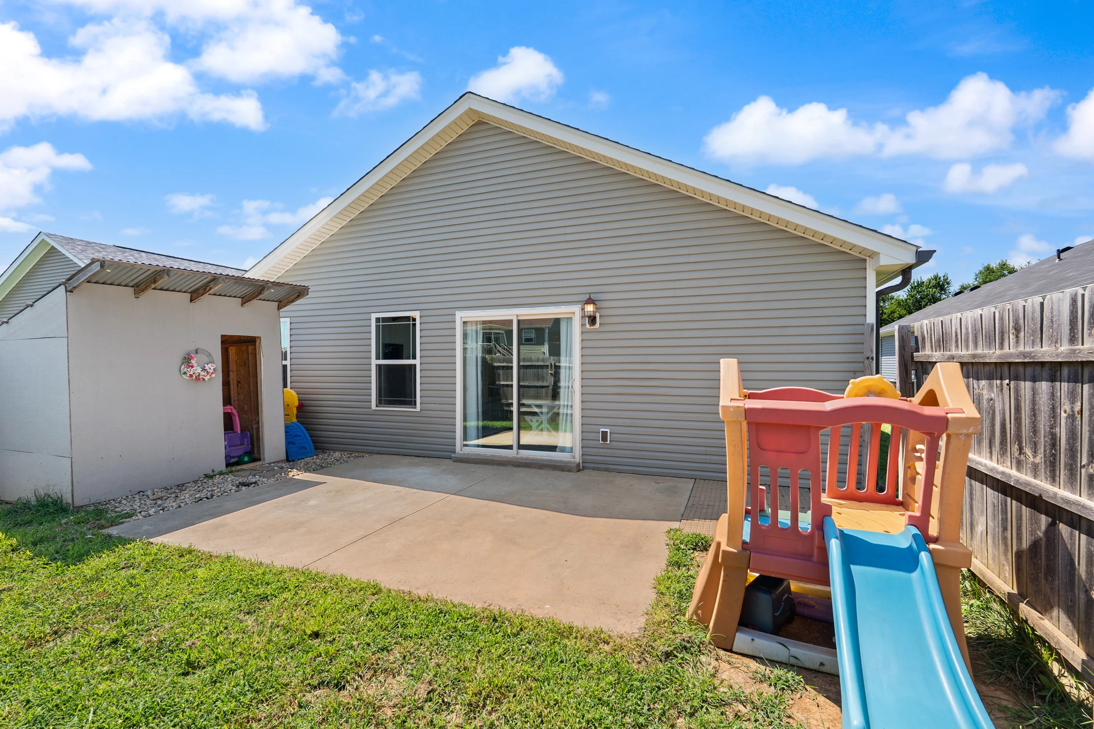 Rear patio and backyard at 8002 Kismet Drive