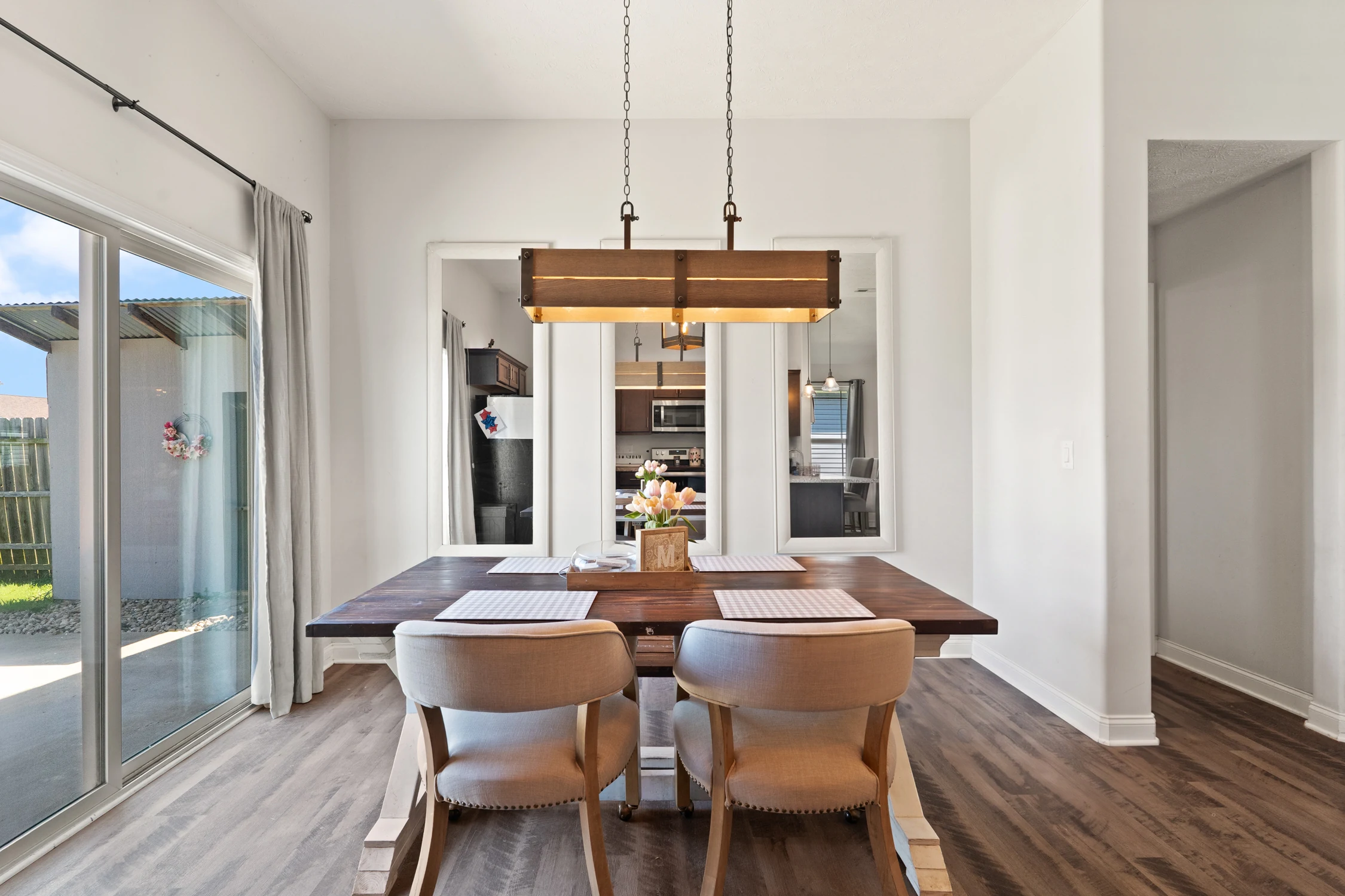 Bright dining area beside sliding doors leading to the rear patio