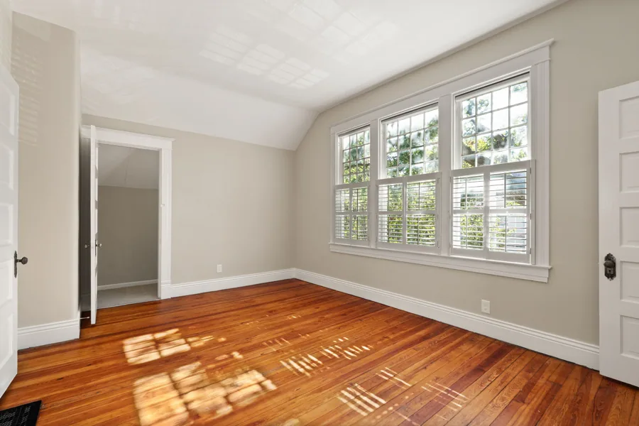 Sunlight across the hardwood floor in an upstairs bedroom. 1839 Sherwood Avenue, Louisville, Kentucky.